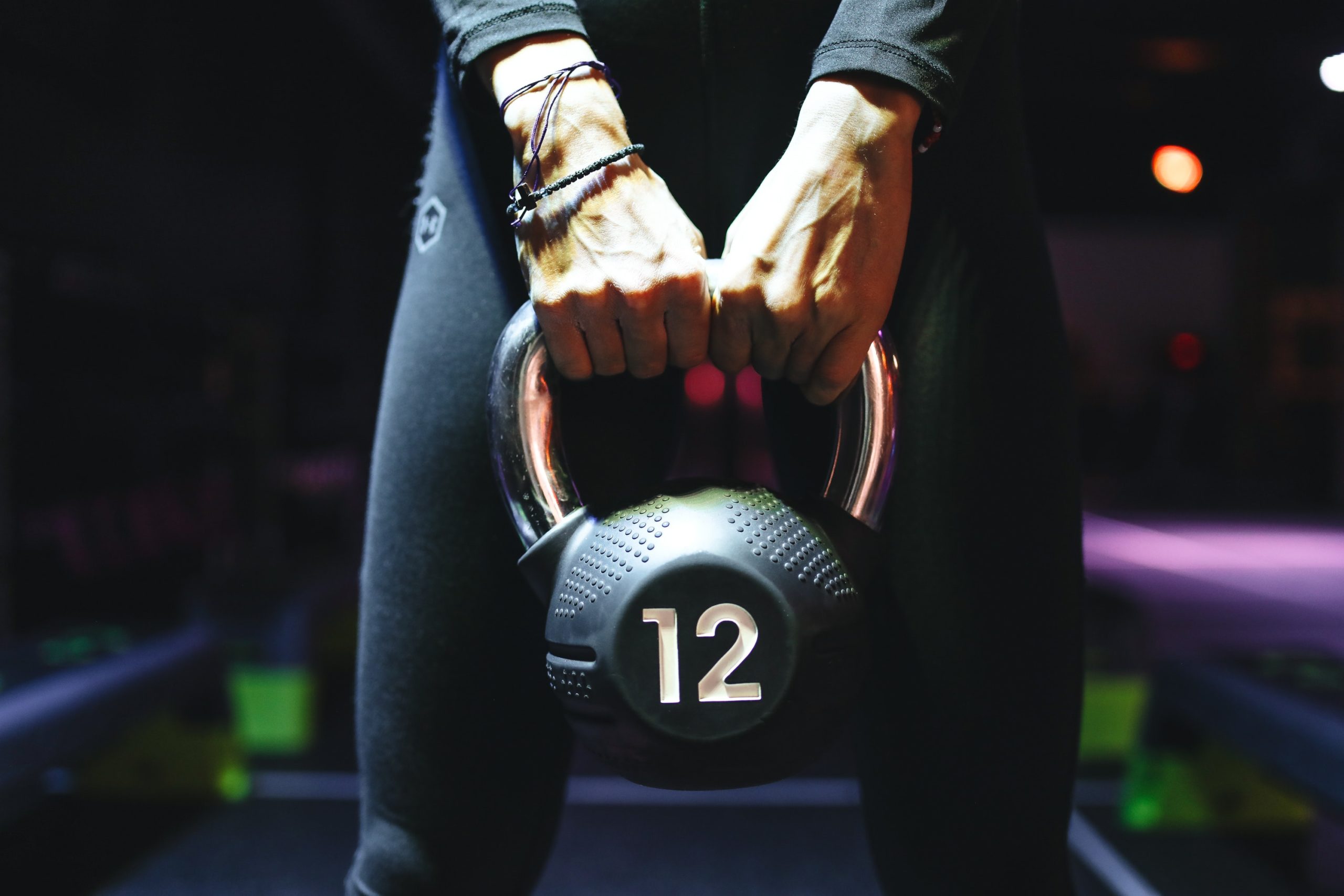 person-holding-kettlebell-3875385